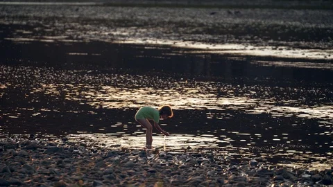 The child is fooling around in the river 스톡 동영상 94243548