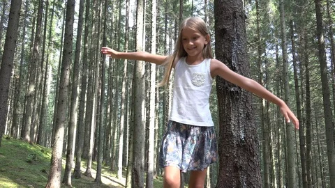 Child in Forest Walking Tree Log, Kid Playing in Park, Camping Adventure Girl  Stock Footage 94359718