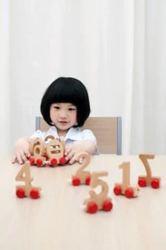 A child gains knowledge in play Stock Photos