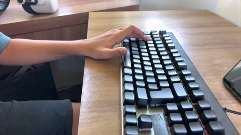 Child gaming hands on mouse and mechanical keyboard, slow motion 4K60 Stock Footage 331104246