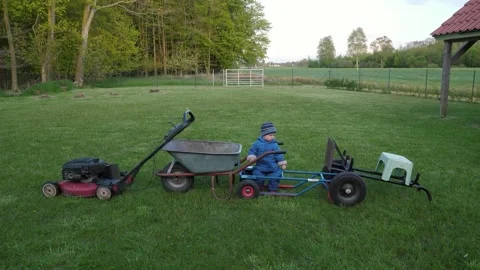 Child with gardening tools Stock Footage 322198662