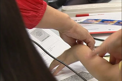 Child gets fingerprinted Stock Footage 10985203