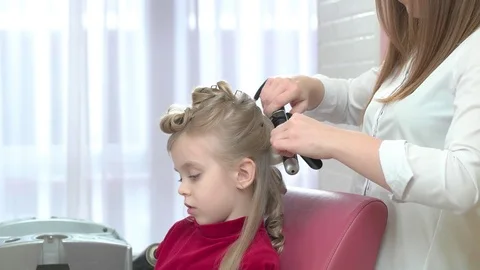 Child getting hair done. Stock Footage