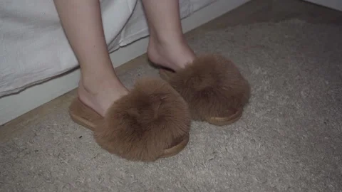 Child getting out of bed at night and putting on slippers Video stock 297459955