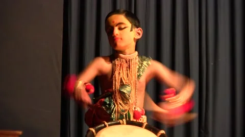 Child getting ready for Kathakali dances theatrical with tambour Stock Footage 52158463