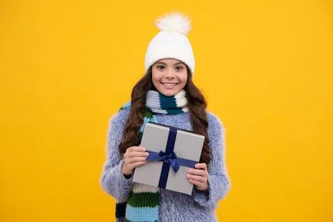 Child with gift present box on isolated background. Presents for birthday Stock Photos
