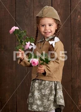 Child girl are dressed as soldier in retro military uniforms Stock ...