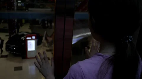 Child girl going down the elevator in the dark. Shopping center when it closes. Stock Footage 273568194