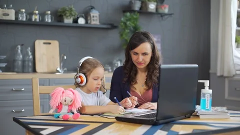 Child Girl Learning Lessons Online with Mother Stock Footage 128635525