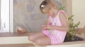 Child girl playing game on smartphone (three shots sequence) HD Footage
