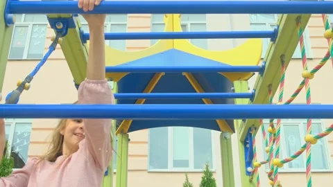 Child girl playing on monkey bars Stock Footage 277502004
