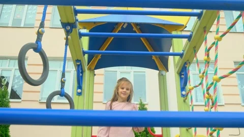 Child girl playing on monkey bars Stock Footage 277623833