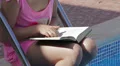 Child girl reading a book HD Footage