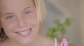 Child girl with smiling face looking at camera (portrait) HD Footage