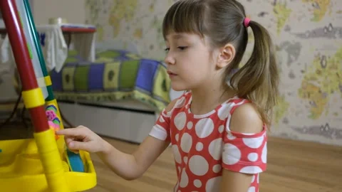 Child girl using abacus to learn numbers and account at home Stock Footage 148079244