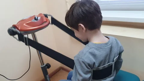 The child is given vibration massage to improve health. Stock Footage 272310664