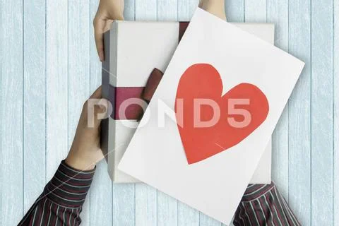 Child giving present and card to father Stock Photos