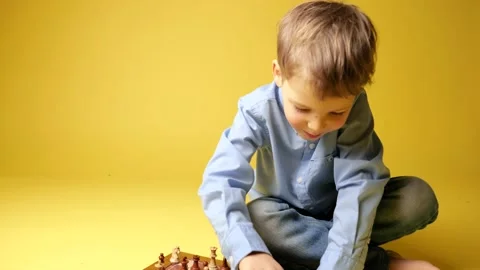 Child with glasses playing chess Stock-Footage 150207724
