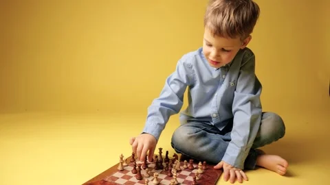 Child with glasses playing chess Stock-Footage 150208609