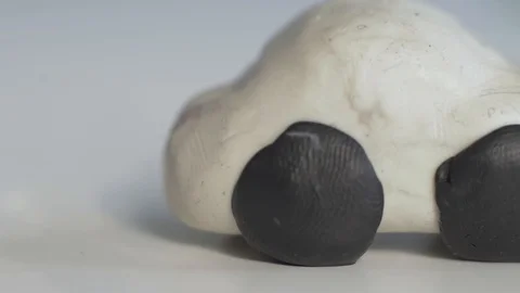 A child glues a headlamp to a plasticine machine Stock Footage 124208708