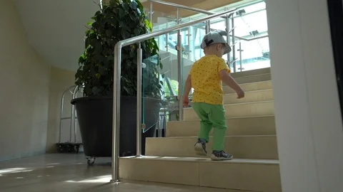 The child goes up the stairs Stock Footage 109112014