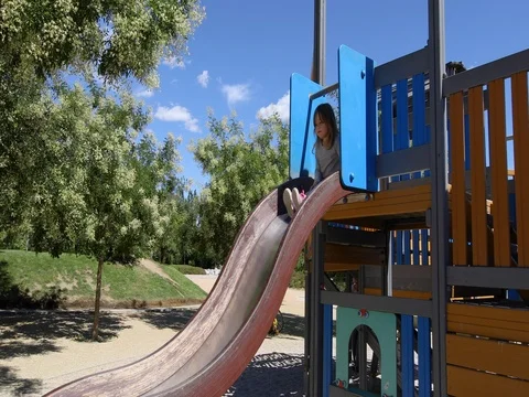 Child going down in double slide Stock Footage 77206887