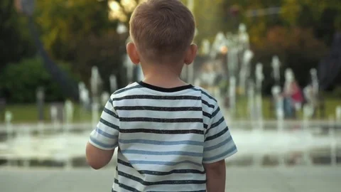 Child going towards fountain Stock Footage 79927175