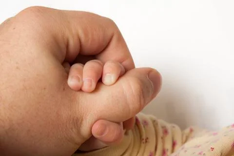 Child grabbing a hand Stock Photos