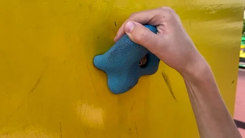 The child grabs the hold of the climbing wall. Close-up view Stock Footage 158832259