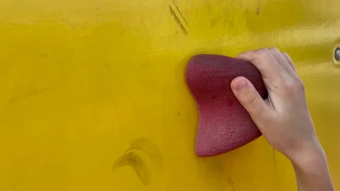 The child grabs the hold of the climbing wall Video stock 159087066