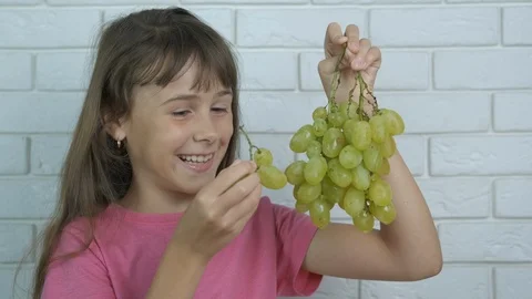 A child with grapes. Stock Footage 116830534