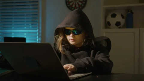 Child hacker with laptop. Hacker kid typing fast on laptop. Kid hacker focused Stock Footage 326345615