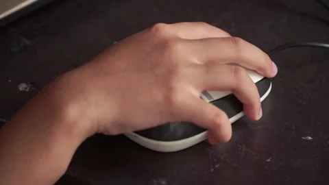 Child hand controlling mouse during online learning. Education, technology use Stock Footage 328655323