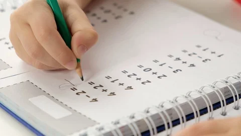 Child hand doing simple math exercises, close up. Mathematics concept Stock Footage 125038430