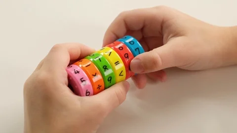 Child hand doing simple math exercises with special ring, close up. Mathematics Video stock 125245581