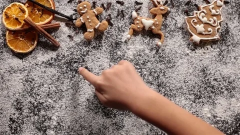 Child hand drawing big snowflake in the xmas cookies flour Stock Footage 80213957