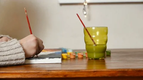 Child hand drawing with brushes on canvas by oil painting Stock Footage 70936442
