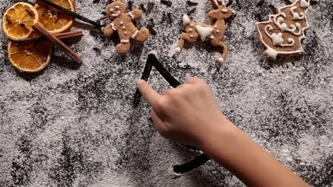 Child hand drawing a christmas tree in the flour Stock Footage 80213980