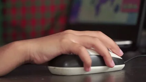 Child hand operating mouse on desk. E-learning, home education, and modern Stock Footage 328655004