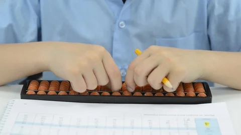 Child hand over math problem counting abacus Stock Footage 92610338