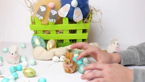 Child hand palying with colorful easter eggs Stock Footage 147377734
