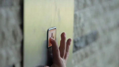 Child hand presses on button with arrow in modern lift Video stock 301384168