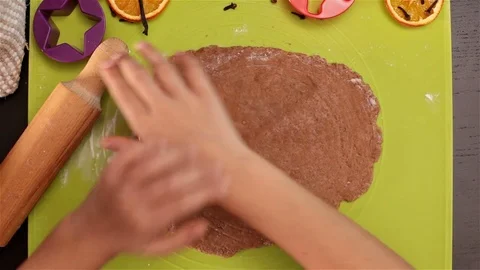 Child hands cutting gingerbread christmas cookie shape Stock Footage 80305300
