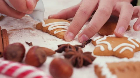 Child hands decorating a pine tree shaped christmas cookie Stock Footage 143110102