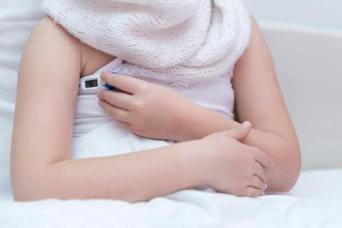 Child hands holding thermometer, closeup. healthcare and medicine concept Stock Photos