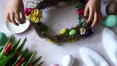 Child hands making Easter composition wreath. Spring Easter Stock Footage 236453148
