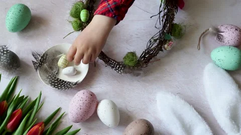 Child hands making Easter composition wreath. Spring Easter holiday Stock Footage 236993457
