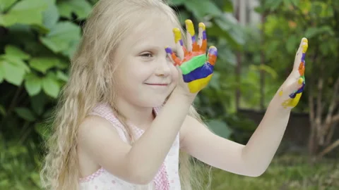 Child hands in paints Stock Footage 136589488