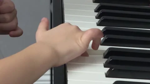 Child Hands on Piano Black Keys, Concept of Exploration and Sensory Learning Stock-Footage 326625841