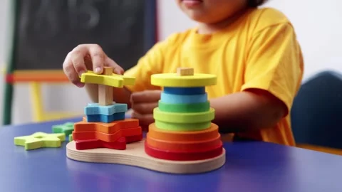 Child hands play with didactic toy at preschool or daycare. Education culture Stock Footage 308686012